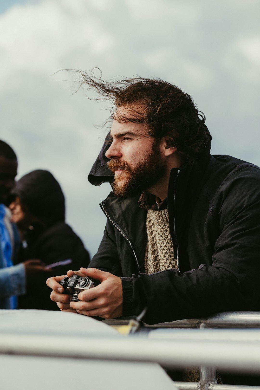 man filming outdoors