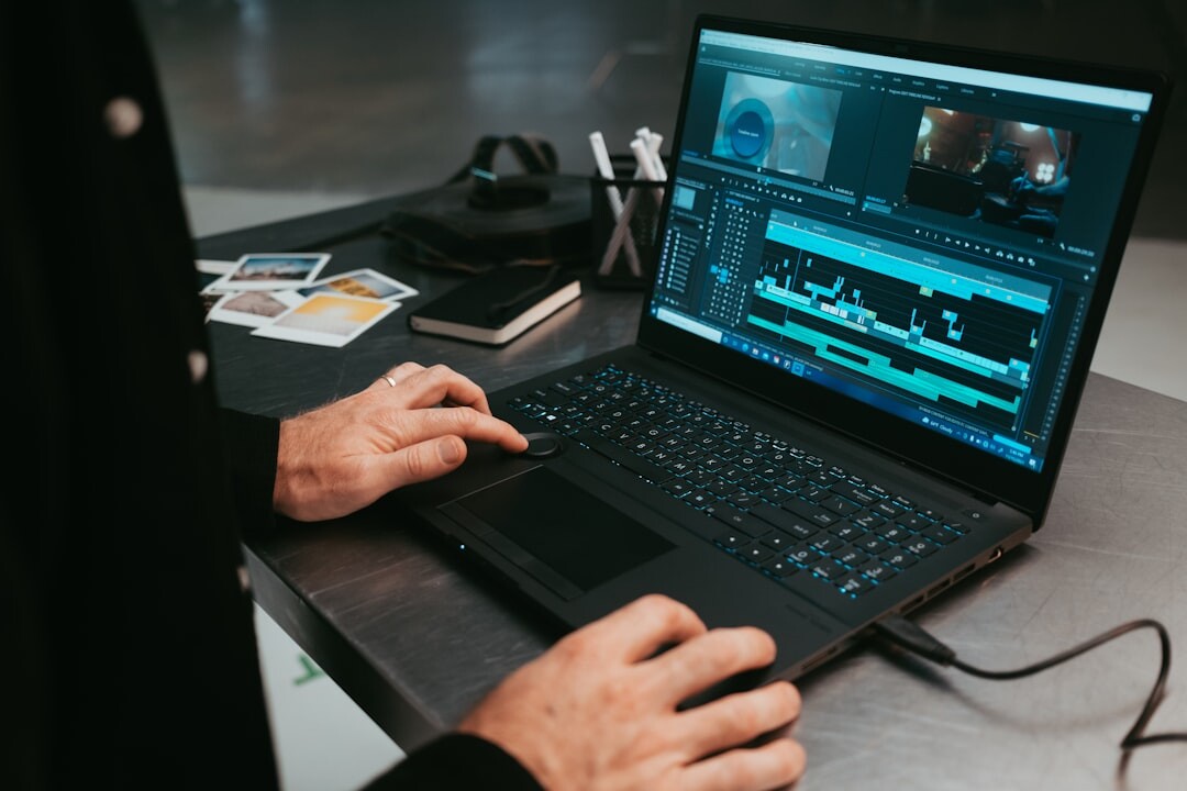 filmmaker editing on laptop