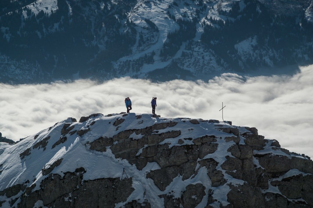 Documentary filmmaker filming an interview outdoors in the Swiss Alps