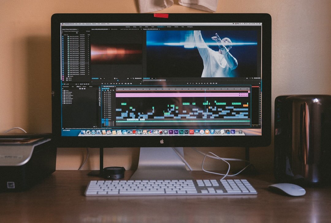 person editing video on computer